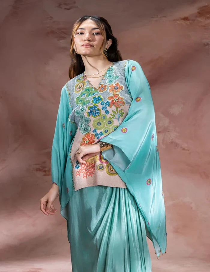 Blue Kaia embroidered kaftan-style top with waist tie-up paired with a flowing crepe drape skirt for women, perfect for festive and contemporary occasions.