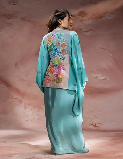 Blue Kaia embroidered kaftan-style top with waist tie-up paired with a flowing crepe drape skirt for women, perfect for festive and contemporary occasions.