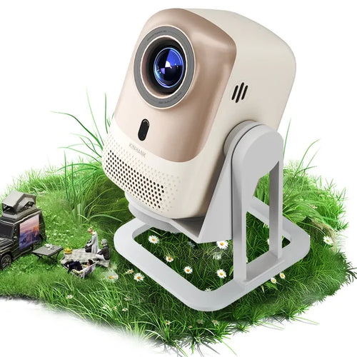 The KINHANK KP1 Mini Projector placed on a grassy surface with a toy setup in the background, indicating its portable and versatile use for home and outdoor theater.