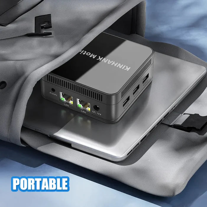 Portable computer device on a gray surface with 'KINHANK MotionX' branding.