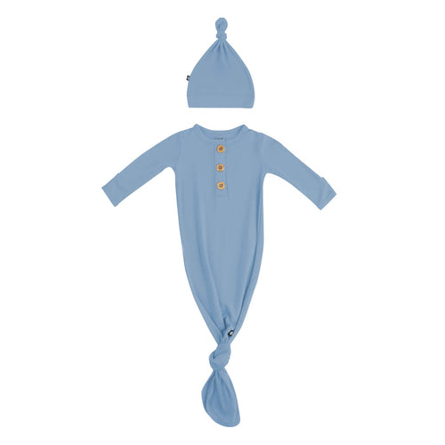 Flat lay of Kyte Baby Knotted Gown with Hat Set in Slate