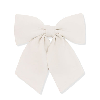 Large cream-colored bow on a white background
