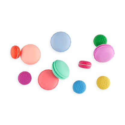 OOLY Le Macaron Patisserie Scented Erasers spread out on pages