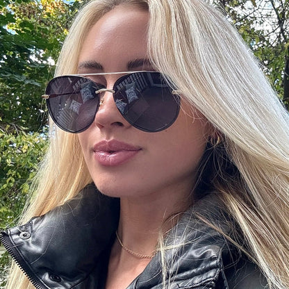 UGC - customer content - female wearing diff eyewear lenox aviator sunglasses with a gold metal frame and blue gradient polarized lenses front view