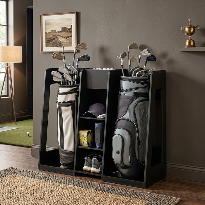 Golf bag and clubs in a black stand against a gray wall with a framed picture and trophy.