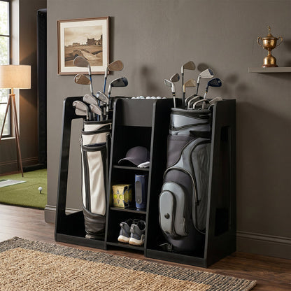 Golf bag and clubs in a black stand against a gray wall with a framed picture and trophy.