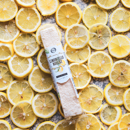 Limoncello nougat lying on a background of sliced lemons