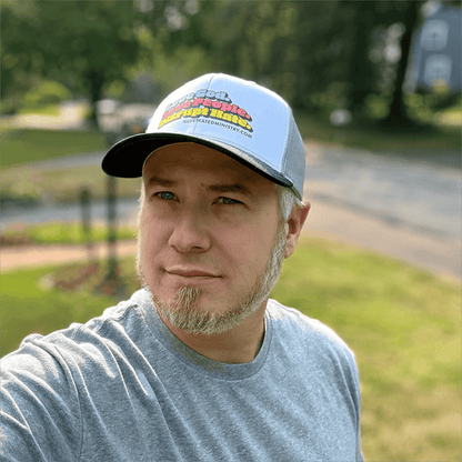 "Love God. Love People. Disrupt Hate." Trucker Hat