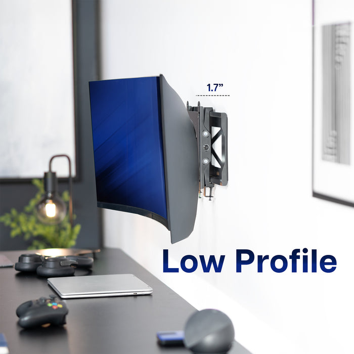 Wall-mounted monitor with 'Low Profile' text on a desk setup.