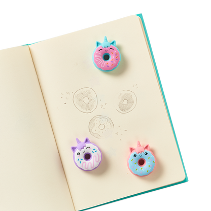 Magic Bakery Unicorn Donut Scented Erasers on a journal
