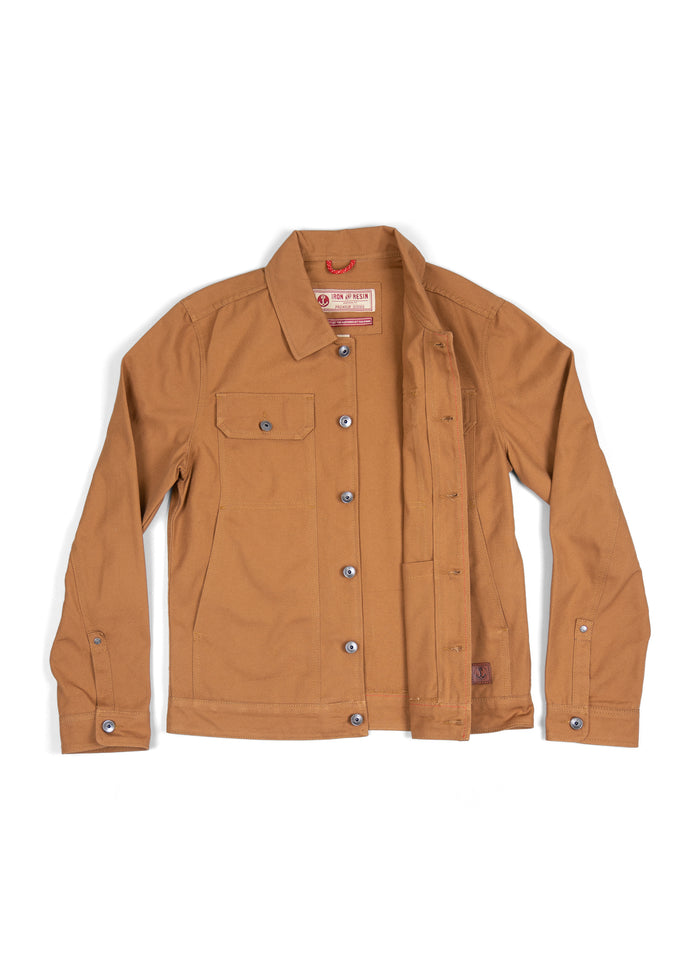 Brown canvas jacket with button closure and chest pocket, laid flat. Iron and Resin label visible inside the collar.