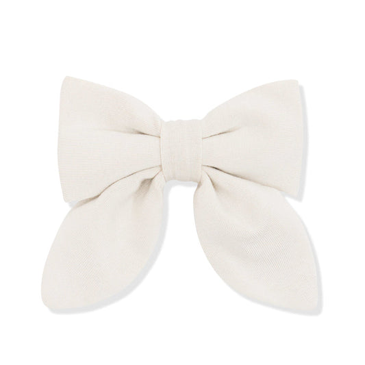 Large cream-colored bow on a white background
