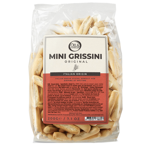 Packaged mini grissini breadsticks in a clear plastic bag with branding and product information displayed on a label.