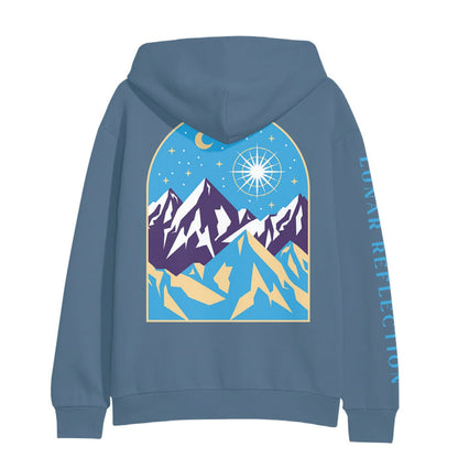 Back of indigo colored hoodie with a drawing of mountains and a night sky. There is a star drawn brightly shining next to the moon above a mountain range.