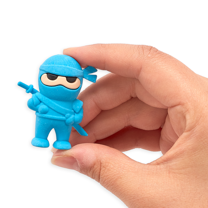Hand holding up blue Ninja Eraser