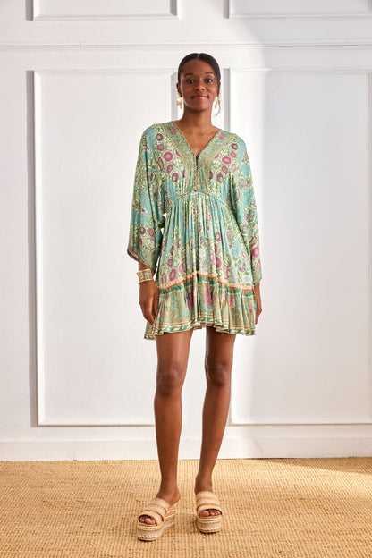 Model wearing NKN Nekane Gaia Aqua Short Viscose Dress with Botanical Print and Japanese Sleeves by nkn nekane, shop Dotique