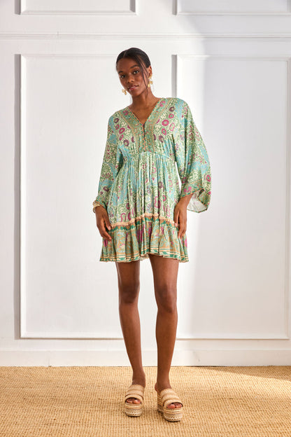 Model wearing NKN Nekane Gaia Aqua Short Viscose Dress with Botanical Print and Japanese Sleeves by nkn nekane, shop Dotique