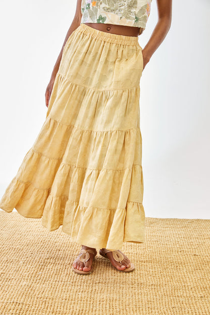 Woman wearing NKN Nekane Riloru Yellow Long Linen Ruffled Skirt by nkn nekane, shop nkn nekane at Dotique