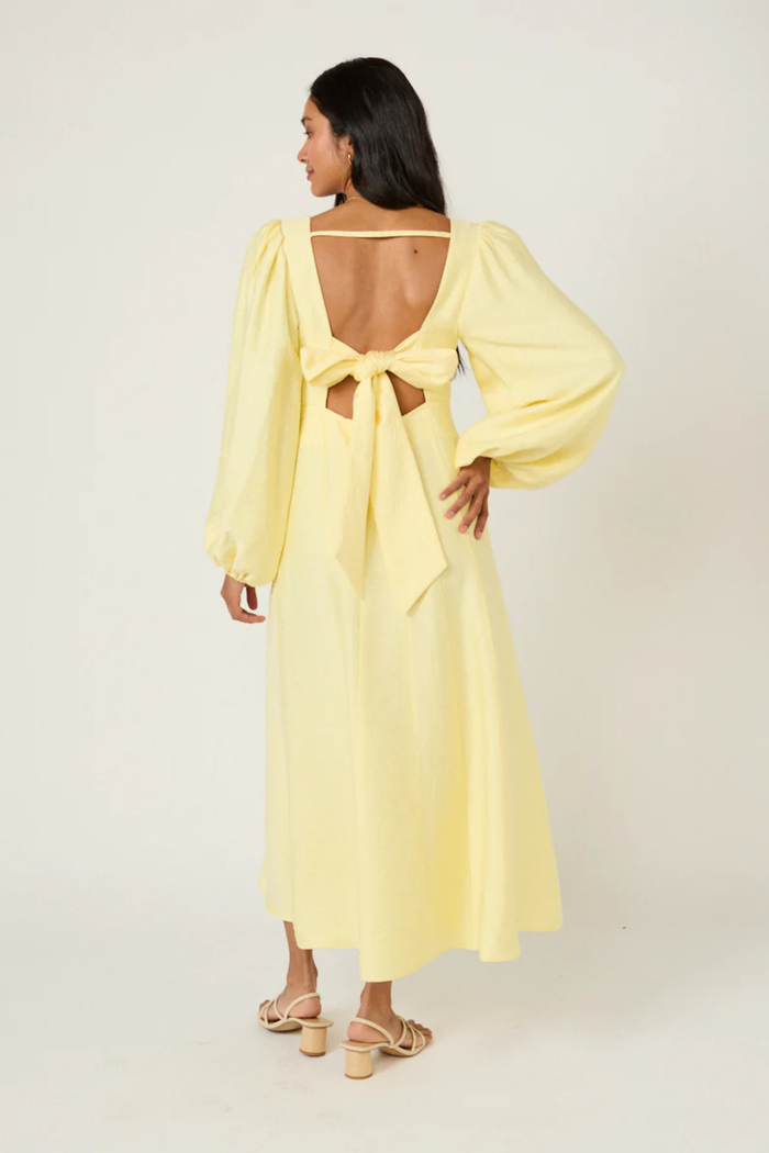 Nobody's Child Butter Yellow Bow Keyaa Midi Dress by nobody’s child shown from back with open bow detail shop nobody’s child at Dotique