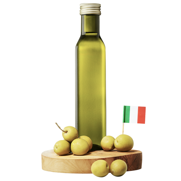 A bottle of Nocellara Extra Virgin Olive Oil on a wooden board, accompanied by a small Italian flag and whole olives.