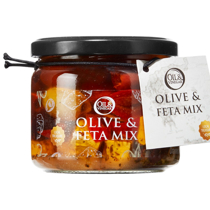 A jar of Olive & Feta Mix, showing green and black olives along with pieces of feta cheese, marinated in oil.