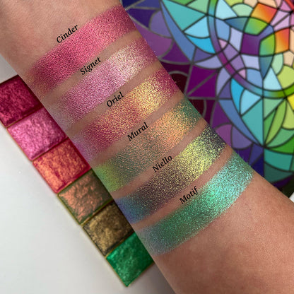 Top angled arm swatches on fair skin tone of Oriel Electric Multichrome Pigment shifts compared to Cinder, Signet, Mural, Niello and Motif