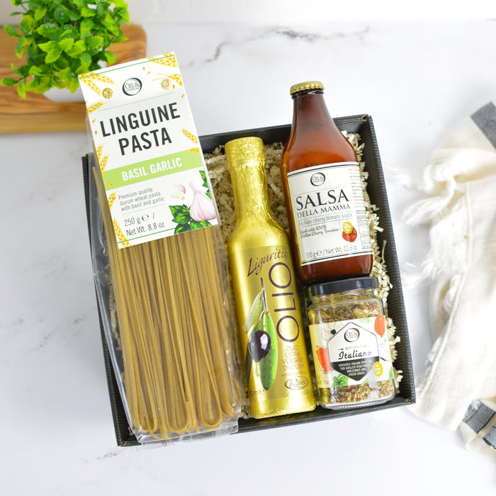 Pasta and sauce set with packaging on a marble surface