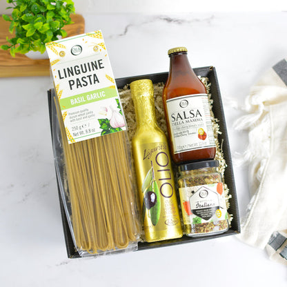 Pasta and sauce set with packaging on a marble surface