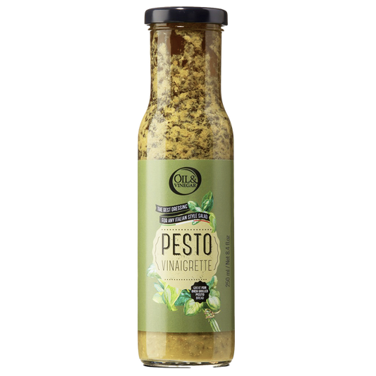 A bottle of Pesto Vinaigrette with a label showing the product name and a brief description.