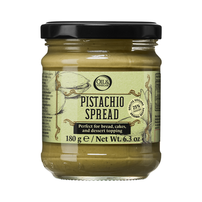 A glass jar of Pistachio Spread with a green label, indicating that it is perfect for bread, cakes, and dessert toppings.