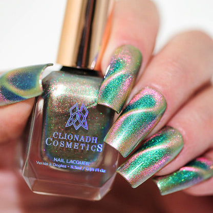 Close up of nails done with Psilocybin Nail Lacquer featuring a design to show off the magnetic effect  on fair skin tone.
