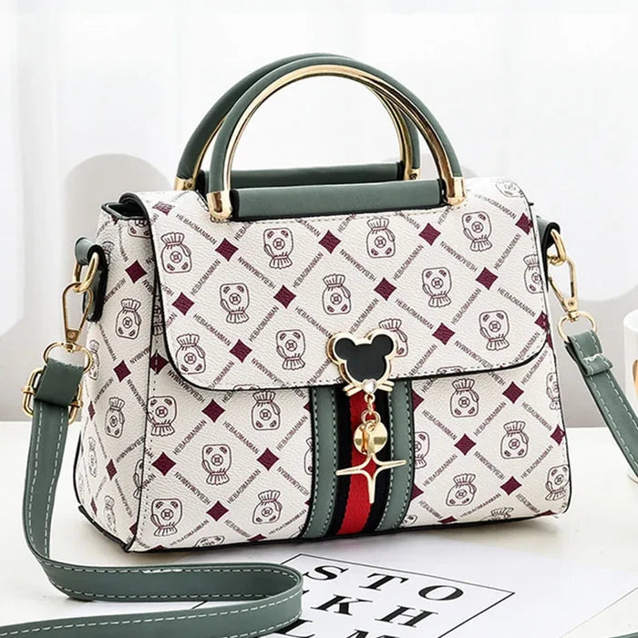 Designer handbag with brand logo on a white background