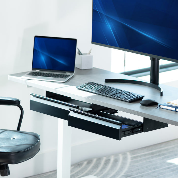Modern office desk setup with laptop, monitor, keyboard, and mouse on a white background