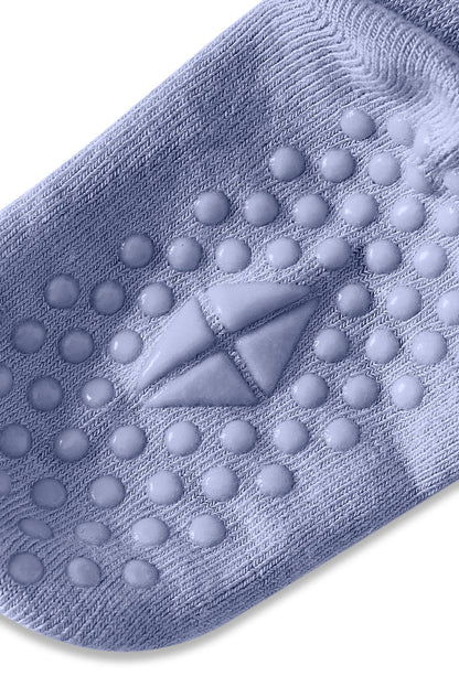 Angled bottom of sock with grips.