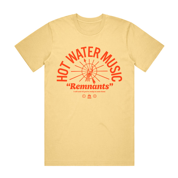 Butter colored T shirt. The Text "HOT WATER MUSIC" is printed in an arch in the center of the shirt. There is a circle Under the arch with many lines coming from the center. There is a hand in the center of the circle holding an arrow. The text "Remnants" is printed under the circle and arch. The hot water music logo is also printed underneath the text. The whole design is a tomato red color.
