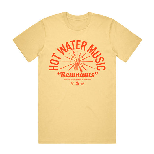Butter colored T shirt. The Text "HOT WATER MUSIC" is printed in an arch in the center of the shirt. There is a circle Under the arch with many lines coming from the center. There is a hand in the center of the circle holding an arrow. The text "Remnants" is printed under the circle and arch. The hot water music logo is also printed underneath the text. The whole design is a tomato red color.