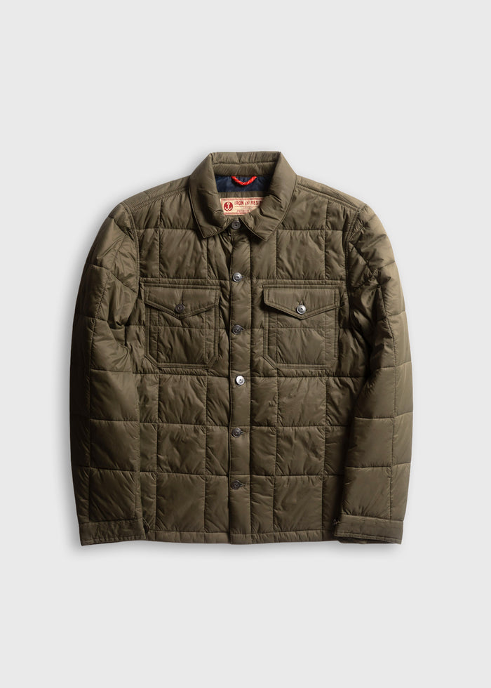 Olive quilted jacket with button closure, two chest pockets, and a collar, displayed on a plain white background.