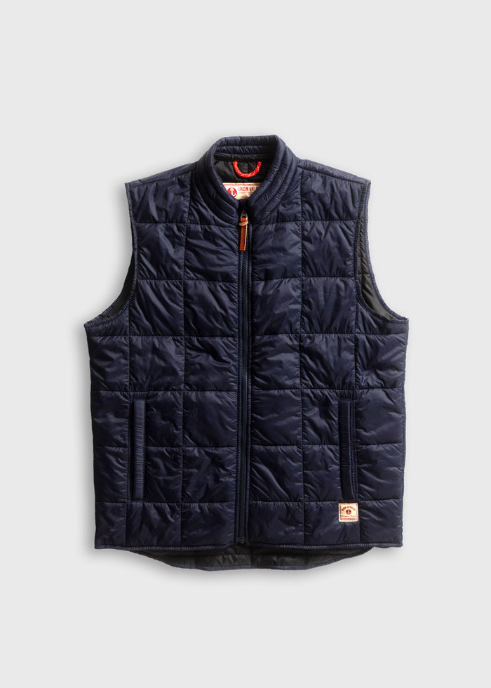 Navy quilted vest with front zipper and pockets, displayed on a light gray background, showcasing a casual, stylish design.