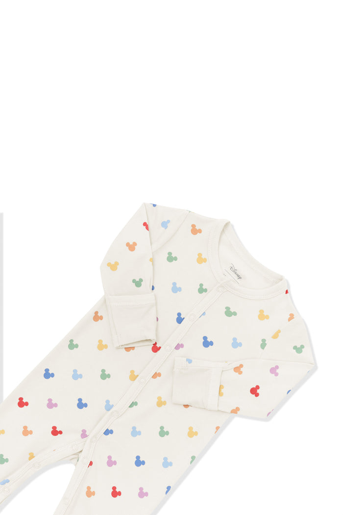 Top part of Romper in Pastel Mickey Mouse pattern on an oat background