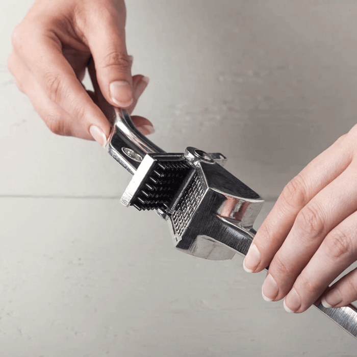 Royal Industries 7 inch Aluminum Garlic Press  This garlic press features pressing nubs that force the garlic through a stainless steel blade. It is extremely easy cleaning and won't leave your hands smelling like garlic all day-ROY GP Hannah's Variety Store