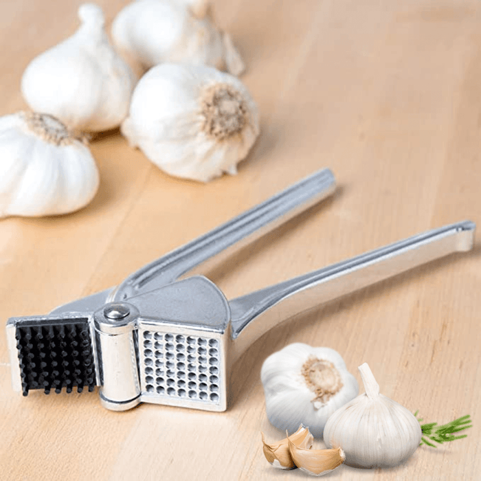 Royal Industries 7 inch Aluminum Garlic Press  This garlic press features pressing nubs that force the garlic through a stainless steel blade. It is extremely easy cleaning and won't leave your hands smelling like garlic all day-ROY GP Hannah's Variety Store