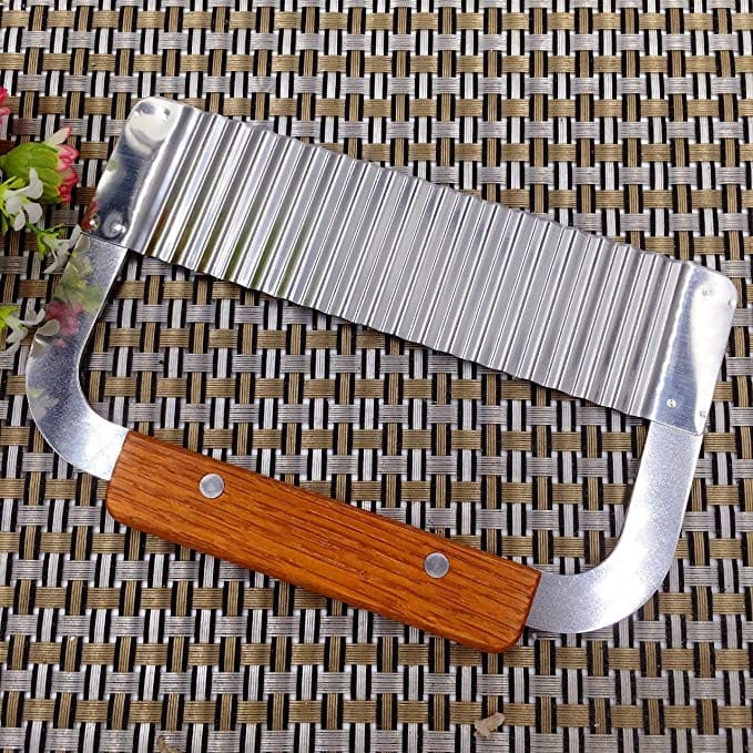 Royal Industries Stainless Steel Serrator 7 inch with Wood Handle This kitchen tool features a highly durable construction which is perfect for commercial use. ROY GR 230 Hannah's Variety Store