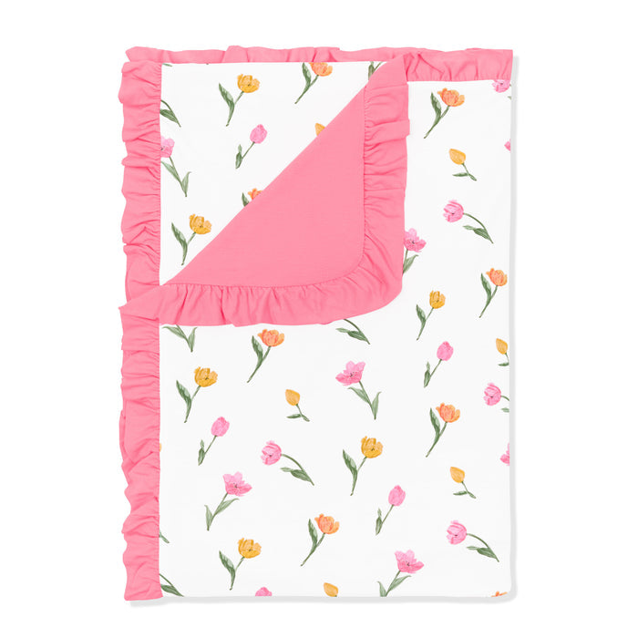 Ruffle Toddler Blanket in Tulip 0.5 with the corner flipped down showing the pink backing