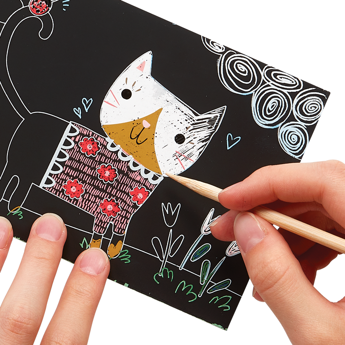 Hands scratching cat artwork of the OOLY Cutie Cats Scratch and Scribble Mini Scratch Art Kit
