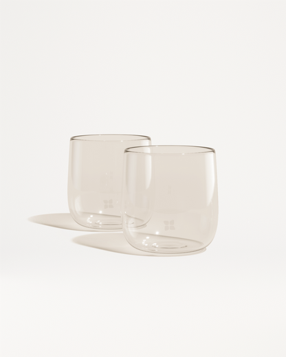 Signature Glasses: Two elegant borosilicate glasses set, perfect for enjoying beverages with a minimalist design.