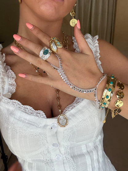 Cool jewellery stack with chunky gold statement pieces