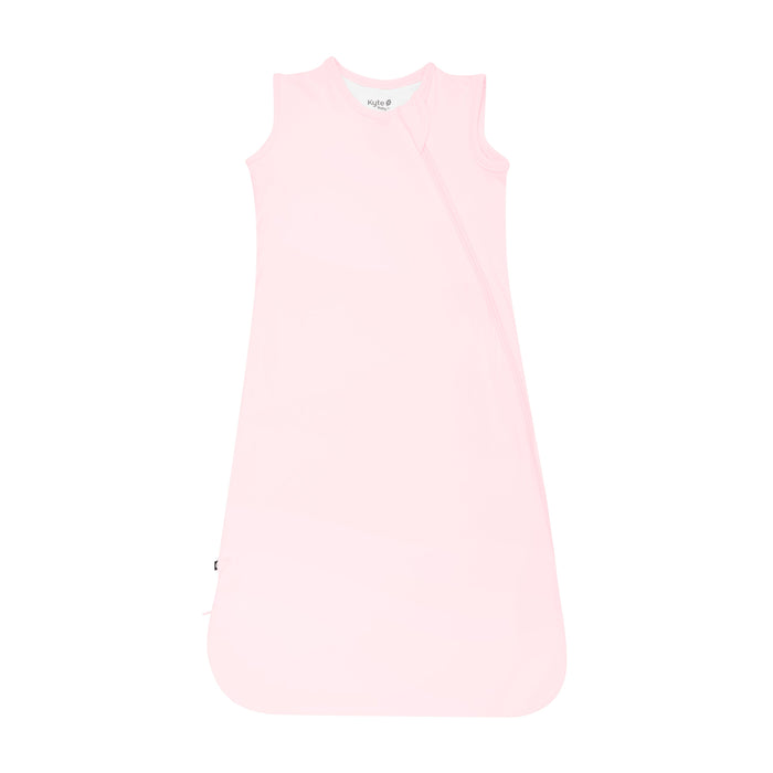 Flat lay photo of the Kyte Baby Sleep Bag in Sakura 0.5