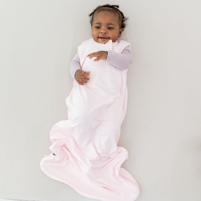 Baby wearing Kyte Baby bamboo Sleep Bag TOG 0.5 in Sakura pink
