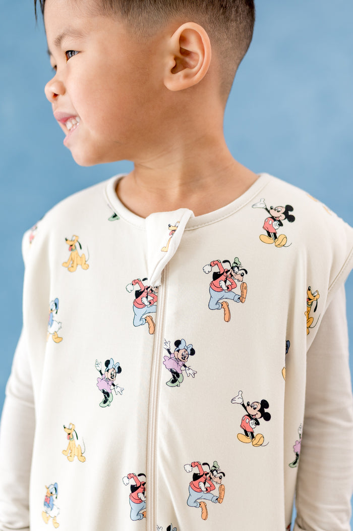Close up of sleep bag walker in a mickey and friends pattern with zipper garage