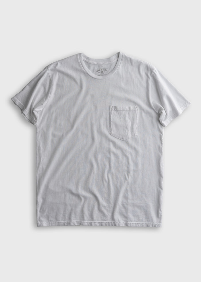 White T-shirt with a chest pocket on a plain background, showcasing simple design and casual style.